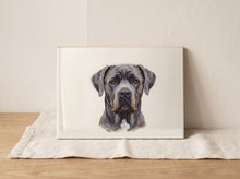 Painterly true-to-coat pet memorial portrait fired onto a ceramic keepsake, on a cream surface in soft natural light